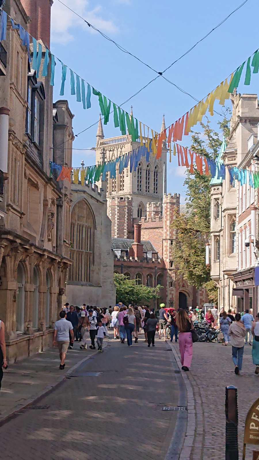 Trinity Street with summer bunting and St John's tower