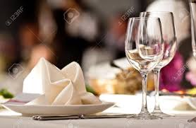 Elegant table set with wine glasses and folded napkin